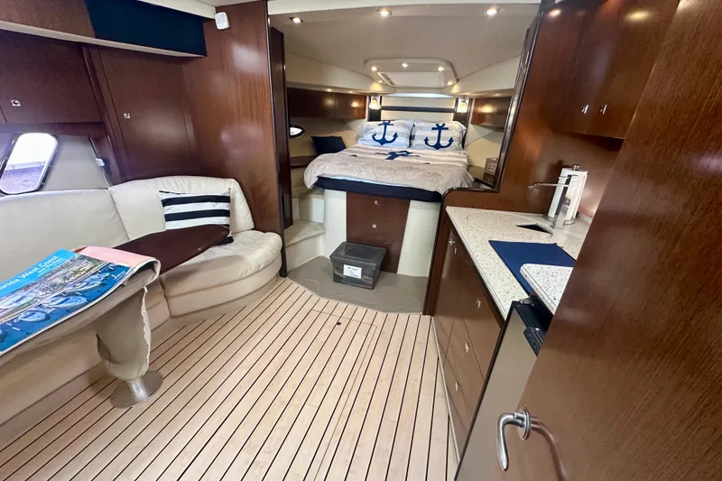 Slide: The Image of Luxurious interior of 2011 Cruisers Yachts 420 Sports Coupe with cozy seating and elegant wood finishes. - 19