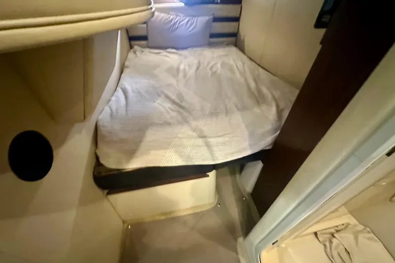 Slide: The Image of 2011 Cruisers Yachts 420 Sports Coupe cabin interior with cozy bed and modern design. - 23