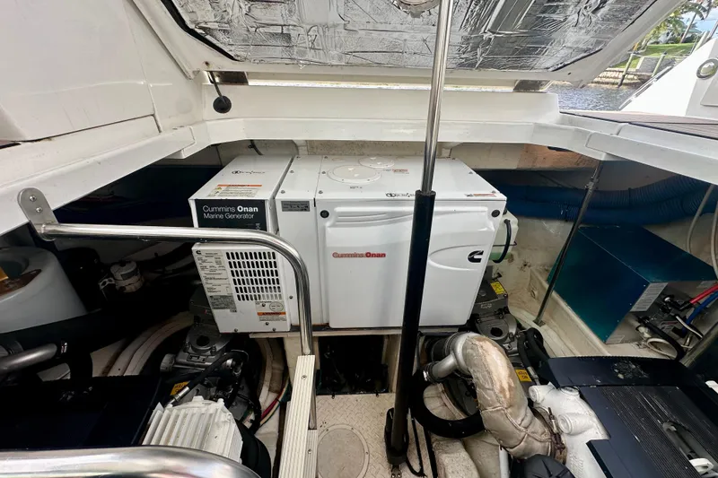 Slide: The Image of Engine compartment of 2011 Cruisers Yachts 420 Sports Coupe with Cummins Onan marine generator. - 25