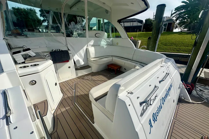 Slide: The Image of 2011 Cruisers Yachts 420 Sports Coupe interior with seating and deck view. - 6