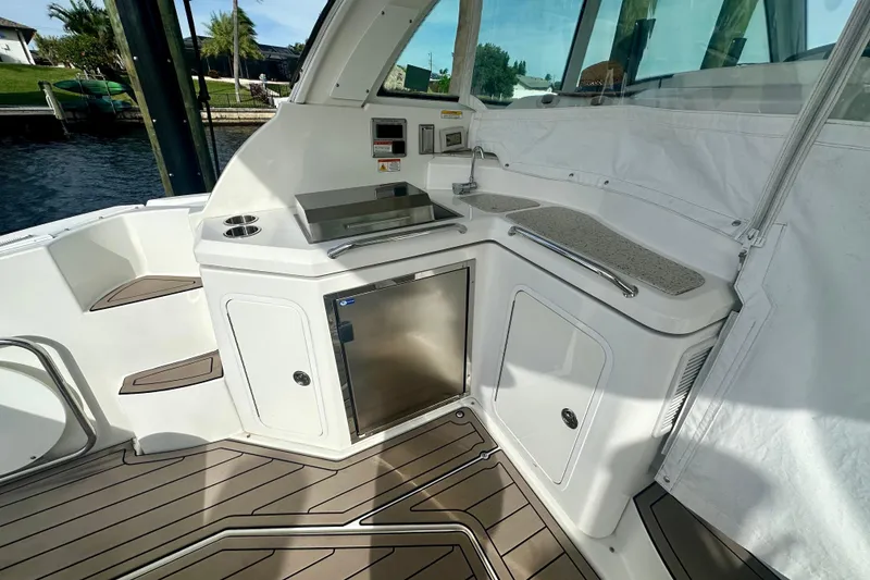 Slide: The Image of 2011 Cruisers Yachts 420 Sports Coupe cockpit with outdoor kitchen and sleek design. - 7