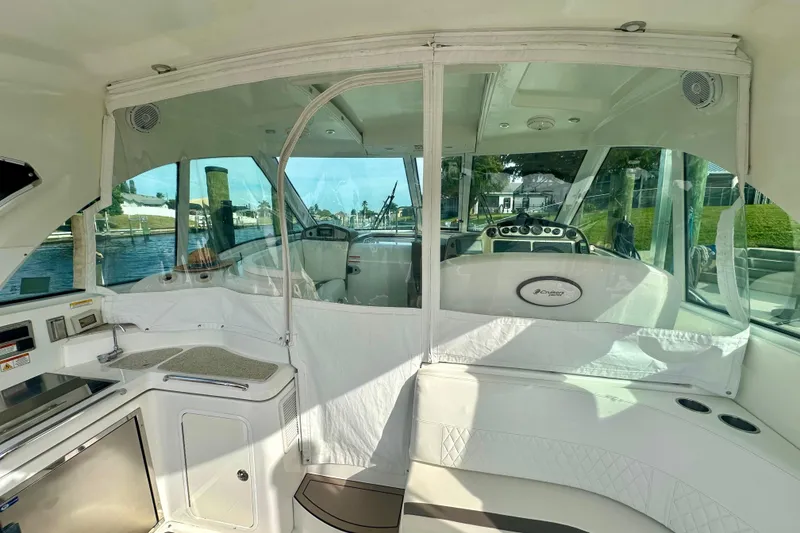 Slide: The Image of 2011 Cruisers Yachts 420 Sports Coupe interior with helm and seating area. - 8