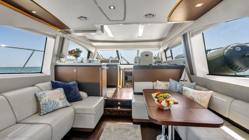 Slide: The Image of Luxurious interior of 2015 Sea Ray 510 Fly yacht with elegant seating and dining area. - 19