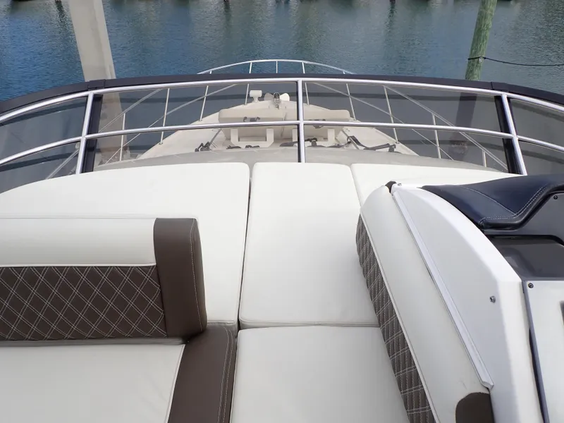 Slide: The Image of 2015 Sea Ray 510 Fly yacht with luxurious deck seating and sleek design. - 25