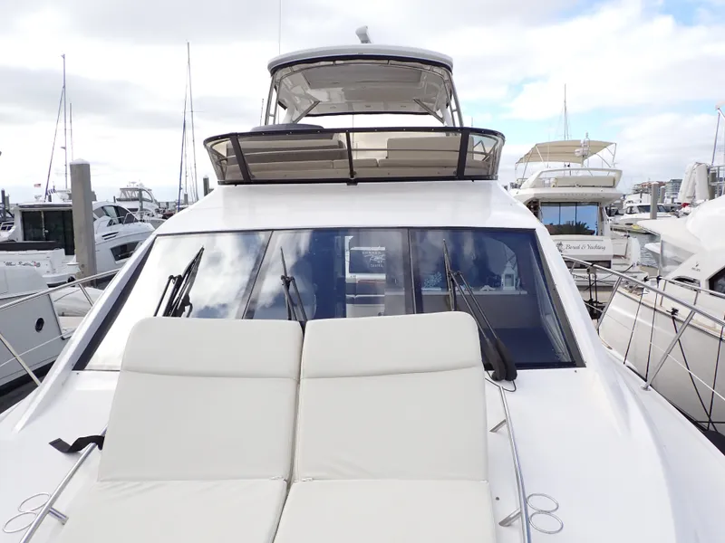 Slide: The Image of 2015 Sea Ray 510 Fly yacht with sleek design, docked at marina. - 29