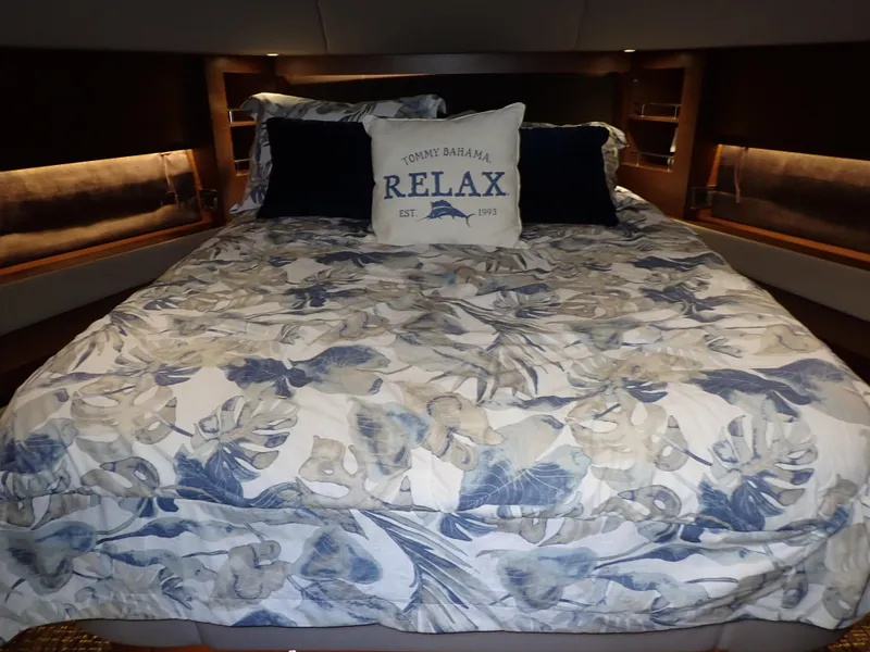 Slide: The Image of Luxurious bedroom in 2015 Sea Ray 510 Fly yacht with floral bedding and "Relax" pillow. - 38