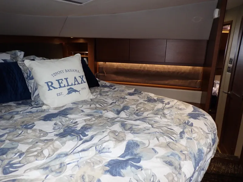 Slide: The Image of Luxurious bedroom interior of 2015 Sea Ray 510 Fly yacht with floral bedding and "Relax" pillow. - 39