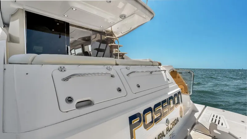 Slide: The Image of 2015 Sea Ray 510 Fly yacht on open water, rear view, sunny day. - 8