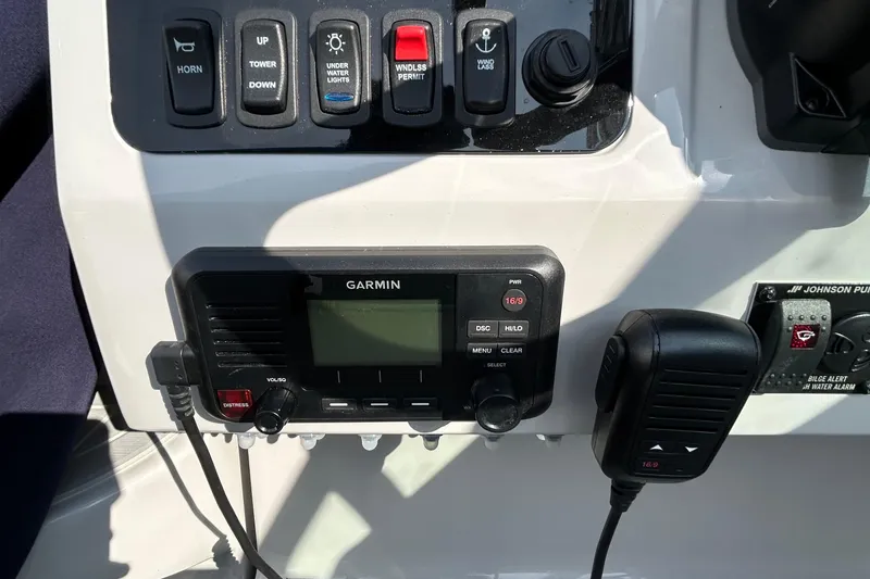 Slide: The Image of Control panel of 2024 Regal 26 XO boat with Garmin marine radio. - 13