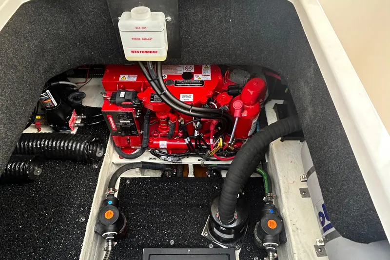 Slide: The Image of Engine compartment of 2024 Regal 26 XO boat with visible Westerbeke components. - 15