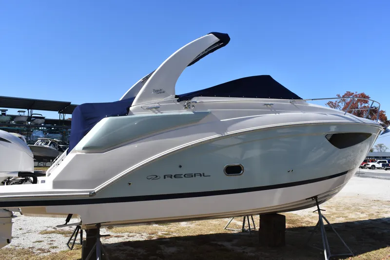 Slide: The Image of 2024 Regal 26 XO boat on display, featuring sleek design and modern amenities. - 4