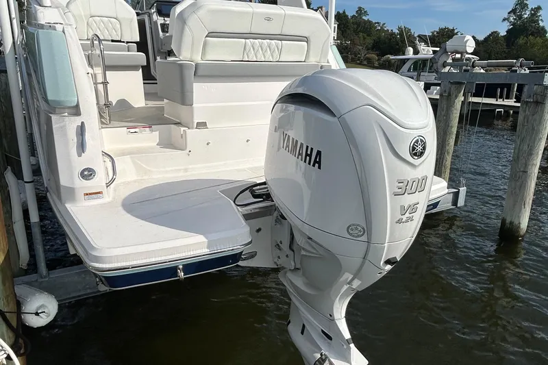Slide: The Image of 2024 Regal 26 XO boat with Yamaha 300 V6 outboard engine at dock. - 8