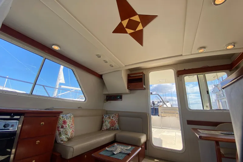 Slide: The Image of Luxurious interior of 2003 Zeta 36 yacht with elegant seating and nautical decor. - 12