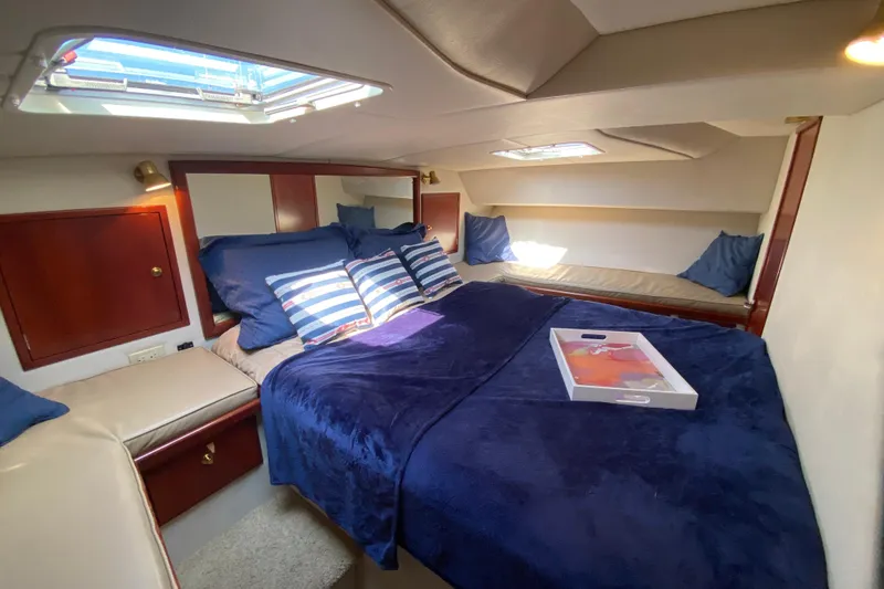 Slide: The Image of Luxurious cabin interior of 2003 Zeta 36 yacht with cozy bedding and skylight. - 18