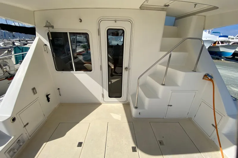 Slide: The Image of Rear deck of 2003 Zeta 36 boat with stairs and door access. - 4