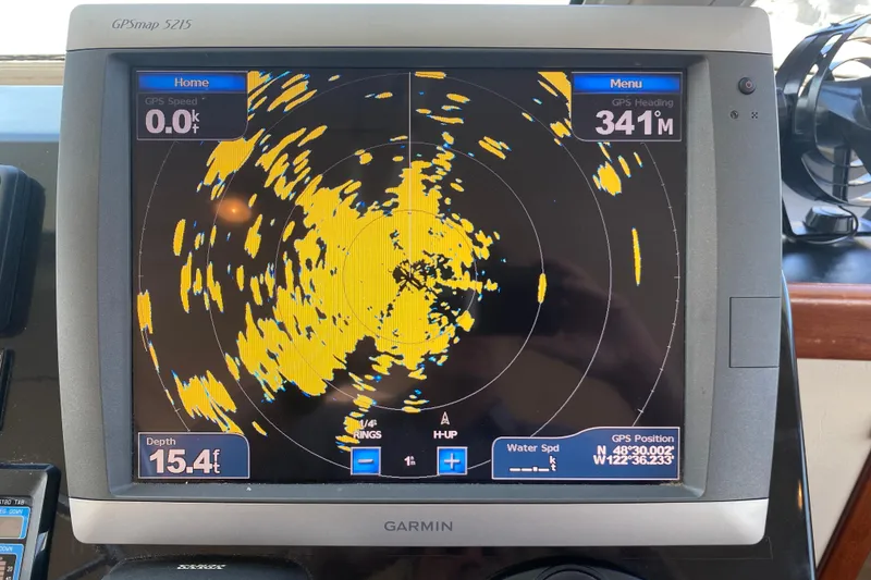 Slide: The Image of Garmin GPSmap 5215 displaying radar data on a Zeta 36, 2003 model boat. - 40