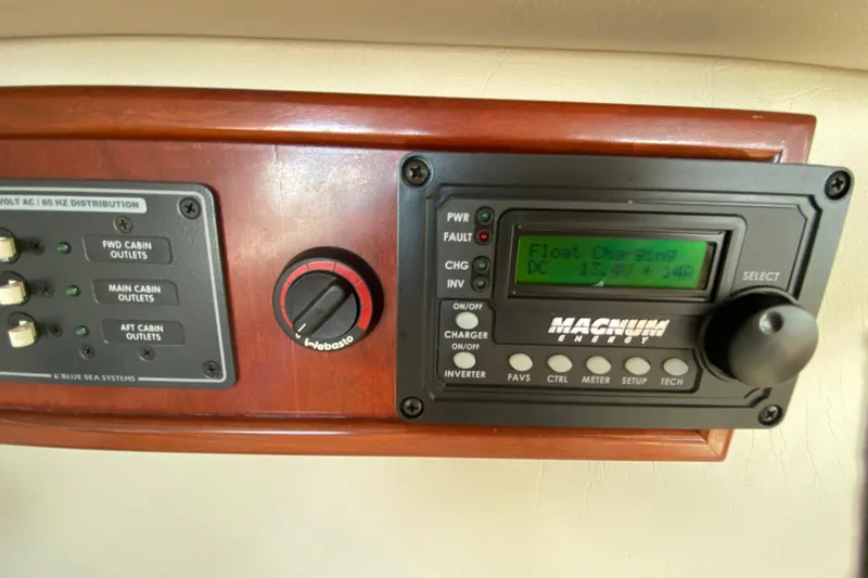 Slide: The Image of Control panel of a 2003 Zeta 36 boat with Magnum Energy display. - 44