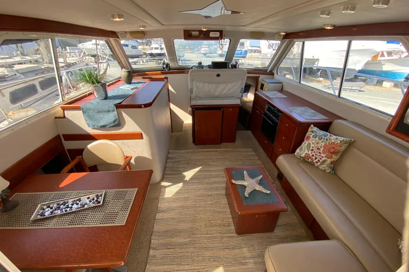 Slide: The Image of Luxurious interior of a 2003 Zeta 36 yacht with elegant seating and decor. - 5