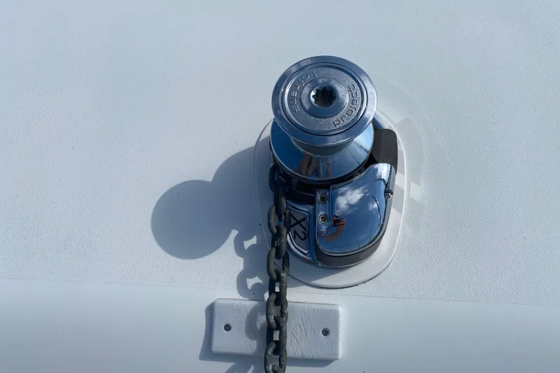 Slide: The Image of Chrome winch on a 2003 Zeta 36 boat deck with chain. - 71
