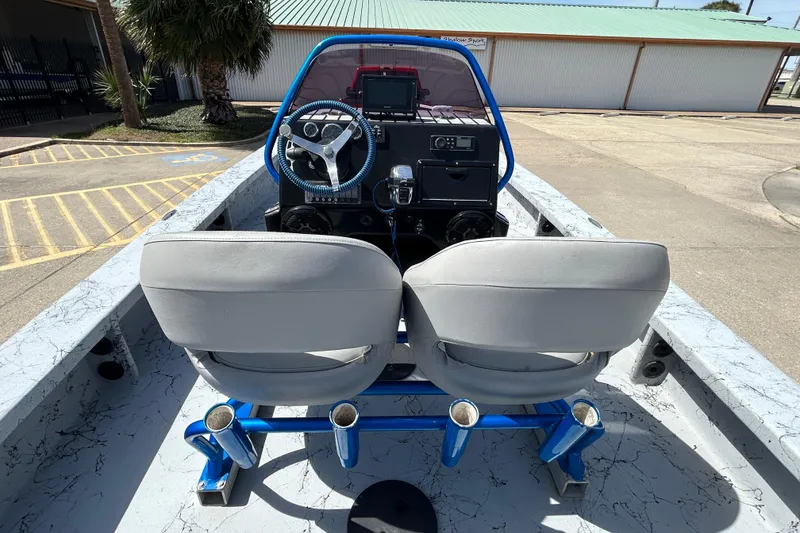 Slide: The Image of 2015 Haynie Magnum boat interior with dual seats and steering console. - 7