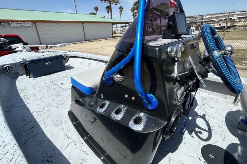 Slide: The Image of 2015 Haynie Magnum boat interior with blue accents and modern controls. - 9