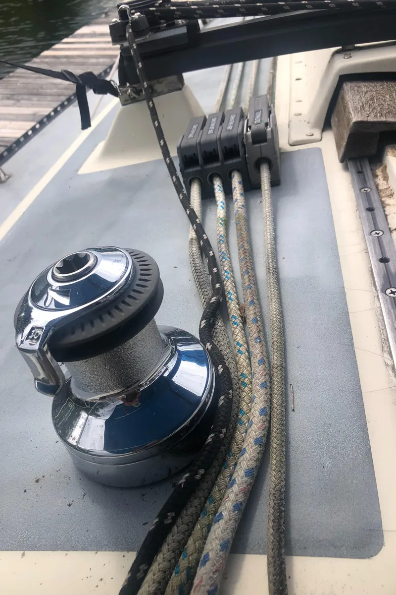 Slide: The Image of Close-up of 1980 Lancer 36 sailboat deck with winch and ropes. - 11