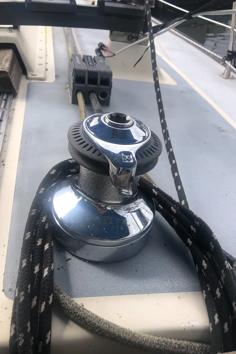 Slide: The Image of Winch on 1980 Lancer 36 sailboat deck with ropes and fittings. - 14