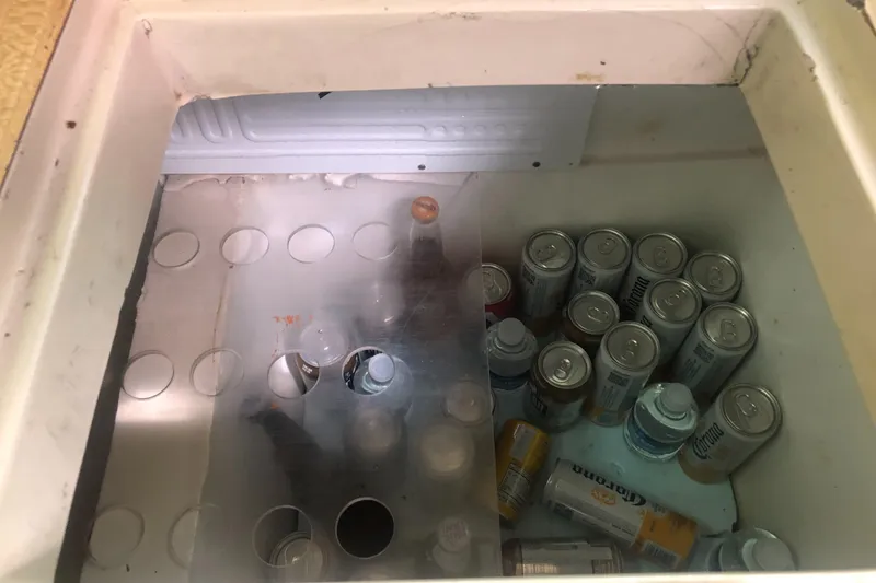 Slide: The Image of Cooler filled with assorted beverage cans, Lancer 36, 1980 model. - 31