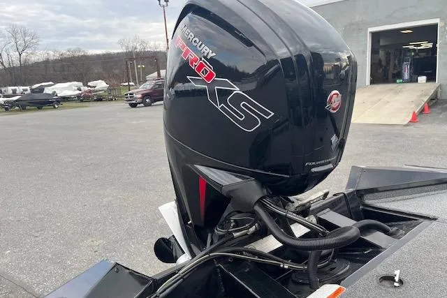 Slide: The Image of 2023 Tracker Pro Team 190 TX with Mercury Pro XS engine in outdoor setting. - 8