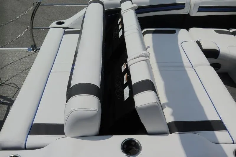 Slide: The Image of 2025 Barletta Corsa 23UC boat interior with white and black seating. - 28