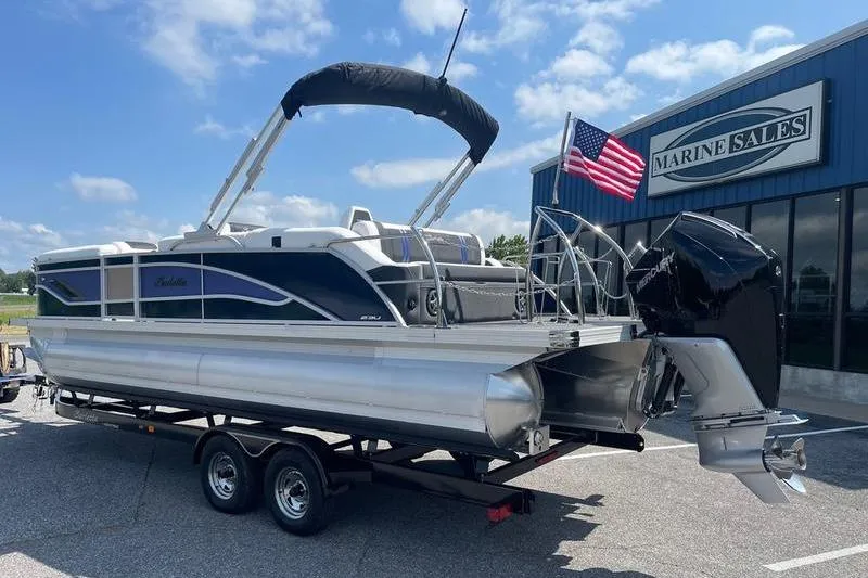 Slide: The Image of 2025 Barletta Corsa 23UC pontoon boat on trailer at Marine Sales dealership. - 3