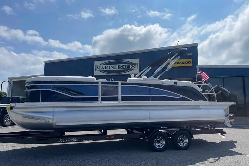 Slide: The Image of 2025 Barletta Corsa 23UC pontoon boat on trailer at Marine Sales dealership. - 33