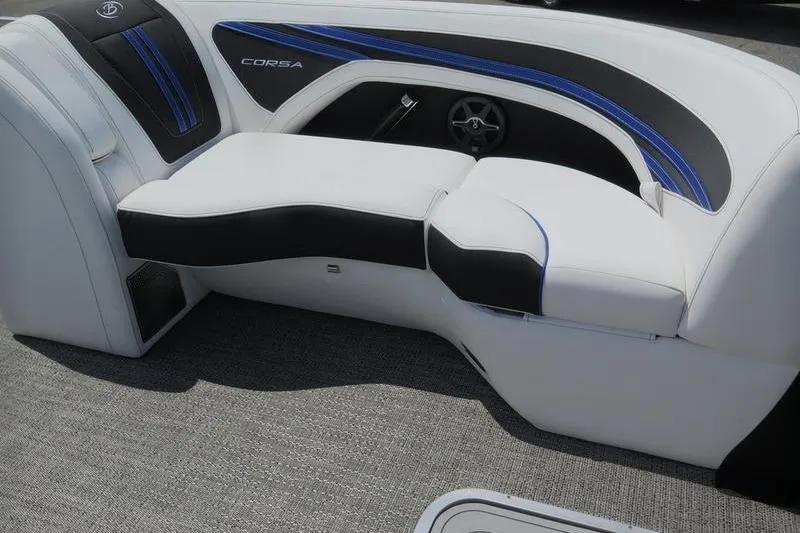 Slide: The Image of 2025 Barletta Corsa 23UC boat interior with sleek white and black seating. - 7