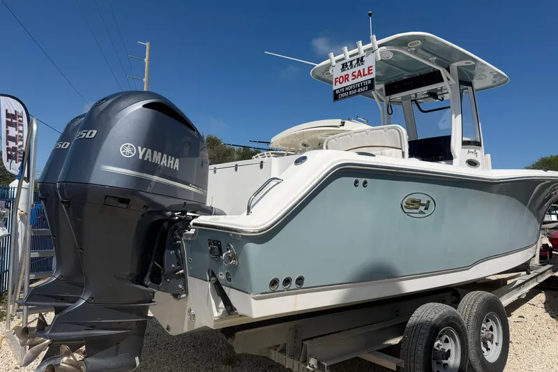 The Image of 2019 Sea Hunt Gamefish 27 boat with Yamaha engine, for sale sign displayed. - 0