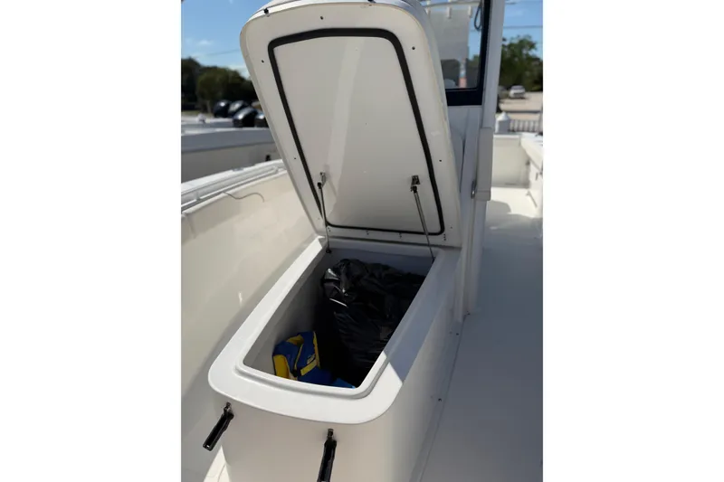 Slide: The Image of Open storage compartment on 2019 Sea Hunt Gamefish 27 boat, showing interior contents. - 13