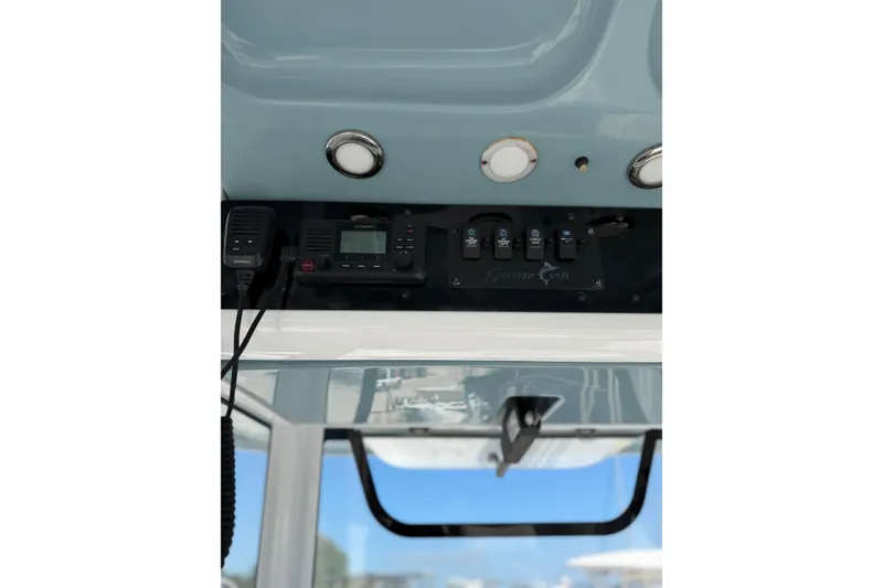 Slide: The Image of 2019 Sea Hunt Gamefish 27 boat dashboard with Garmin electronics and control panel. - 8