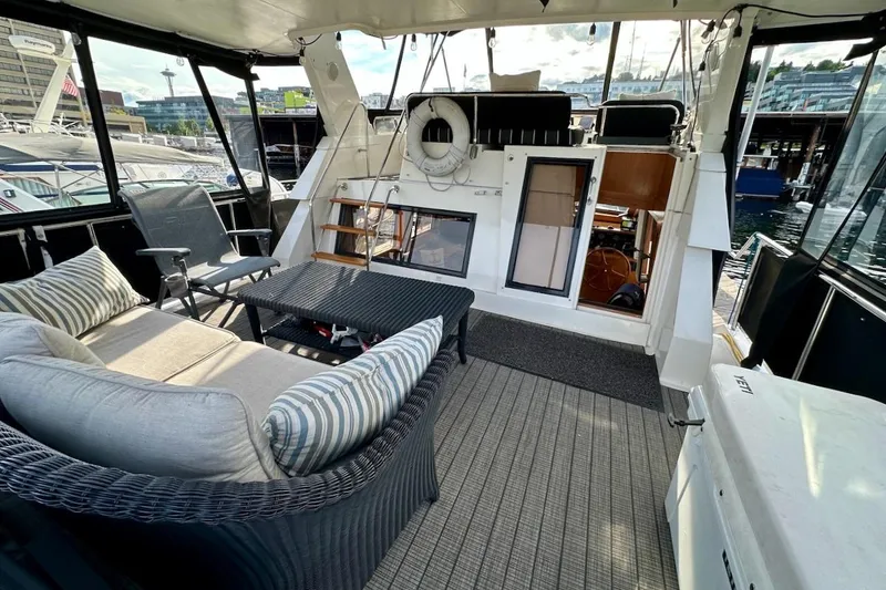 Slide: The Image of Luxurious 1993 Ocean Alexander 460 yacht interior with comfortable seating and waterfront view. - 19