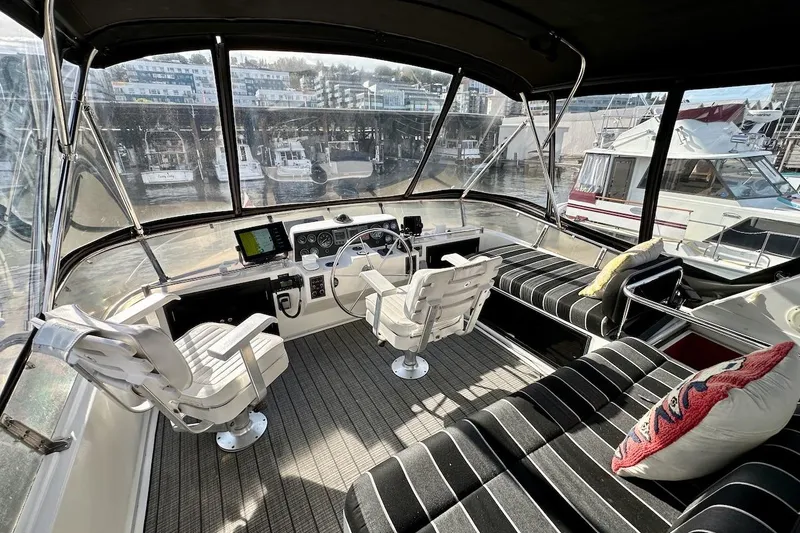 Slide: The Image of Interior view of 1993 Ocean Alexander 460 yacht with helm and seating area. - 23