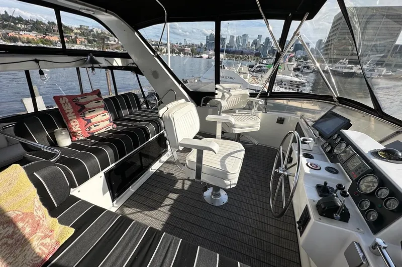 Slide: The Image of Luxurious 1993 Ocean Alexander 460 yacht interior with plush seating and modern helm controls. - 26