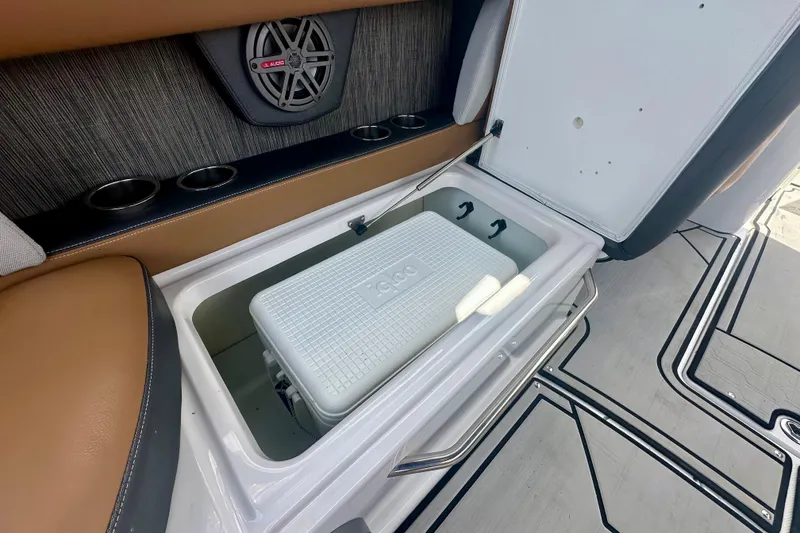 Slide: The Image of 2019 Four Winns HD270 OB boat interior with built-in cooler storage. - 20