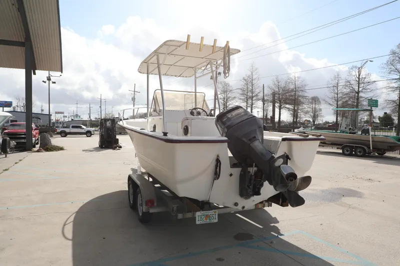 Slide: The Image of 2002 Cape Craft 210 Center Console boat on trailer in parking lot. - 4
