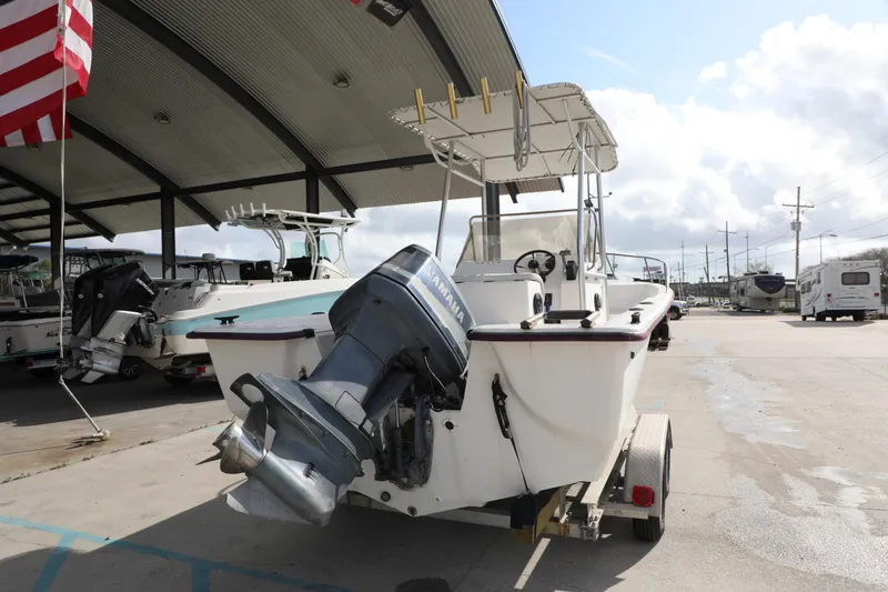 Slide: The Image of 2002 Cape Craft 210 Center Console boat with Yamaha outboard motor on trailer. - 5