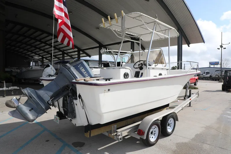 Slide: The Image of 2002 Cape Craft 210 Center Console boat on trailer with Yamaha outboard motor. - 6