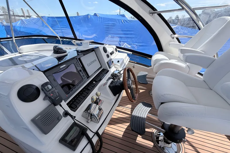 Slide: The Image of Luxurious helm of 2006 Sea Ray 52 Sedan Bridge with advanced navigation systems. - 11