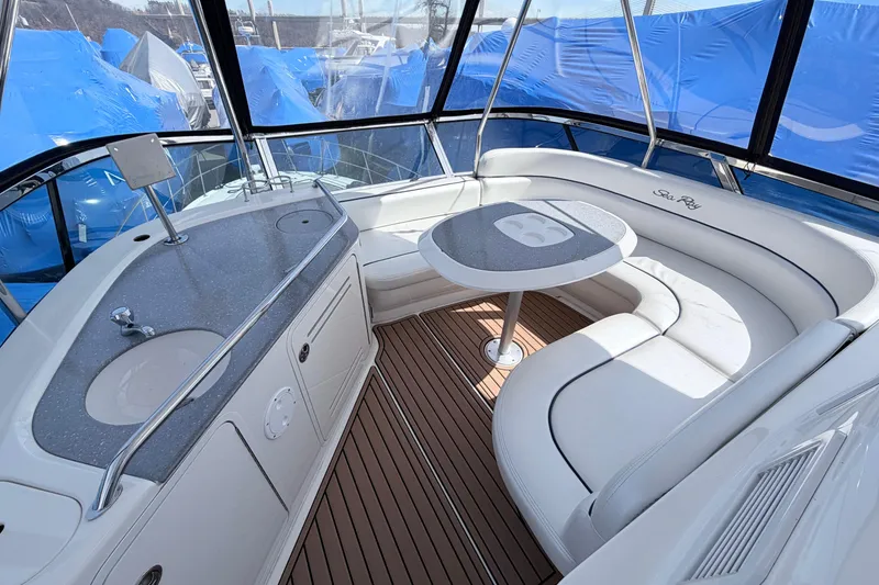 Slide: The Image of 2006 Sea Ray 52 Sedan Bridge yacht interior with seating and table. - 14
