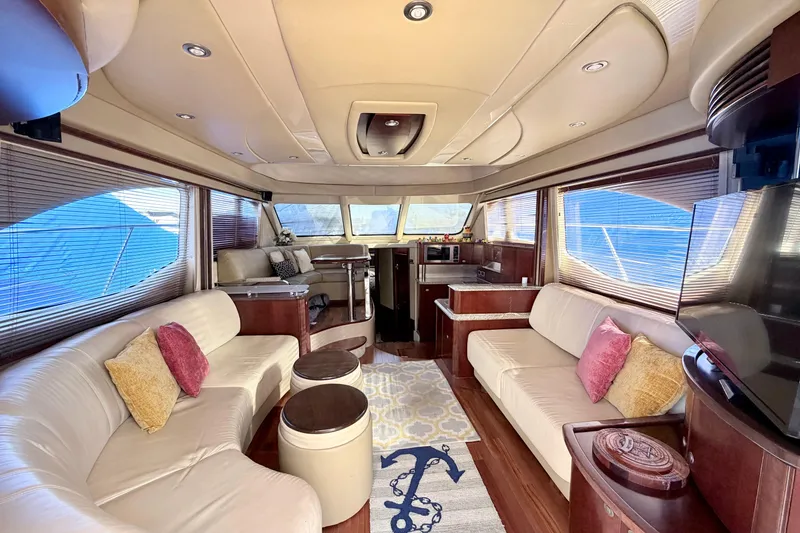 Slide: The Image of Luxurious interior of a 2006 Sea Ray 52 Sedan Bridge yacht with elegant seating and decor. - 19