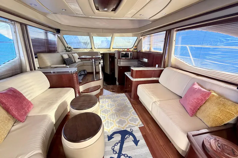 Slide: The Image of Luxurious interior of a 2006 Sea Ray 52 Sedan Bridge yacht with elegant seating and decor. - 20