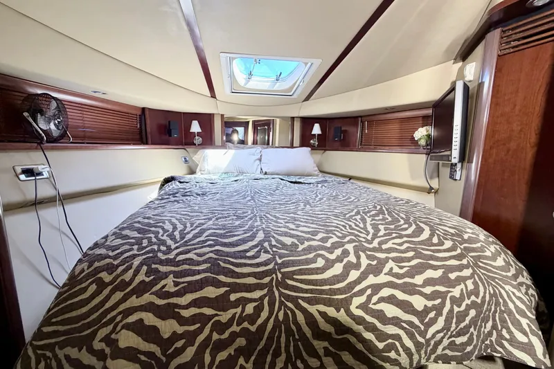 Slide: The Image of Luxurious bedroom interior of 2006 Sea Ray 52 Sedan Bridge yacht. - 28