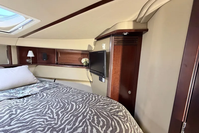 Slide: The Image of Luxurious cabin interior of 2006 Sea Ray 52 Sedan Bridge yacht with zebra-patterned bedding. - 29