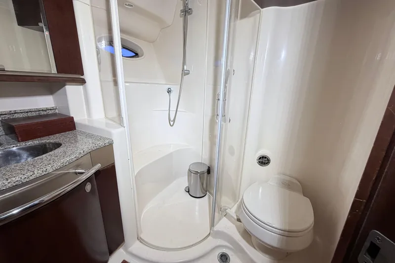 Slide: The Image of Luxurious bathroom in 2006 Sea Ray 52 Sedan Bridge yacht with shower and granite countertop. - 34